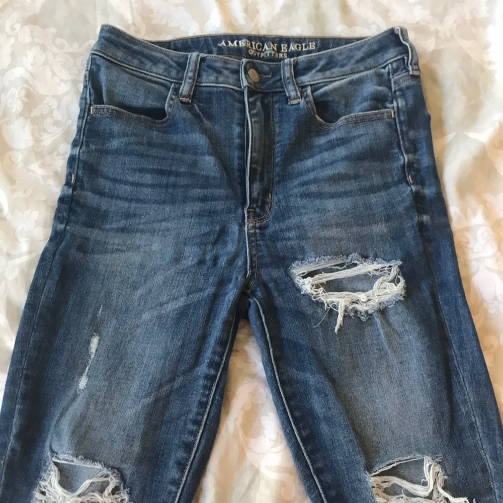 High waisted distressed medium wash jeans